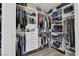 Spacious walk-in closet with custom shelving, drawers, and ample storage for clothes and accessories at 4108 Royal Scots Ave, Las Vegas, NV 89141