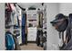 Organized walk-in closet featuring white shelves and drawers, ideal for clothing and accessories at 4108 Royal Scots Ave, Las Vegas, NV 89141