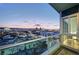 Balcony view of the city skyline and mountains at dusk at 4525 Dean Martin Dr # 1208, Las Vegas, NV 89103