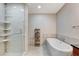 Stylish bathroom featuring a standalone tub, walk-in shower, and modern tile work at 4525 Dean Martin Dr # 1208, Las Vegas, NV 89103