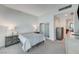 Cozy bedroom with soft lighting, closet, television and access to a full bathroom at 4525 Dean Martin Dr # 1208, Las Vegas, NV 89103