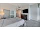 Bright bedroom with expansive windows, closet, television and soft, neutral tones at 4525 Dean Martin Dr # 1208, Las Vegas, NV 89103