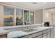 Modern kitchen features granite countertops and incredible city views from large windows at 4525 Dean Martin Dr # 1208, Las Vegas, NV 89103