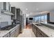 Modern kitchen with stainless steel appliances adjacent to the living room at 4525 Dean Martin Dr # 1208, Las Vegas, NV 89103