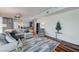 Comfortable living room adjacent to kitchen area, featuring modern decor and hardwood floors at 4525 Dean Martin Dr # 1208, Las Vegas, NV 89103