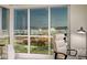 Office with large windows showcasing city views, and a comfortable executive chair at 4525 Dean Martin Dr # 1208, Las Vegas, NV 89103