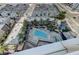 Aerial view of community pool and outdoor lounge area with lush landscaping at 4525 Dean Martin Dr # 1208, Las Vegas, NV 89103