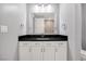 Modern bathroom features a spacious vanity with dark countertop and a mirror at 4575 Dean Martin Dr # 304, Las Vegas, NV 89103