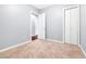 This bedroom features neutral walls and carpet, along with two closets for storage at 4575 Dean Martin Dr # 304, Las Vegas, NV 89103