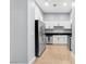 Modern kitchen with stainless steel appliances, white cabinetry, and tile flooring at 4575 Dean Martin Dr # 304, Las Vegas, NV 89103