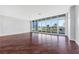 Expansive living room with hardwood floors, neutral paint, and floor-to-ceiling windows at 4575 Dean Martin Dr # 304, Las Vegas, NV 89103