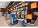 Relax in the elegant resident lounge with cozy seating, custom shelving, and city views at 4575 Dean Martin Dr # 304, Las Vegas, NV 89103