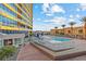 Relax by the community pool with palm trees, lounge chairs, and high-rise buildings at 4575 Dean Martin Dr # 304, Las Vegas, NV 89103