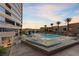 Luxury condo amenities featuring a spacious pool, lounge seating, and resort-style landscaping at 4575 Dean Martin Dr # 304, Las Vegas, NV 89103