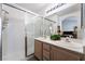 Bright bathroom with a double sink vanity and a glass-enclosed shower at 4719 Sparta Way, North Las Vegas, NV 89032