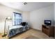 Cozy bedroom with bright natural light and television at 4719 Sparta Way, North Las Vegas, NV 89032