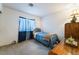 Cozy bedroom with a comfortable twin bed and classic wooden dresser at 4719 Sparta Way, North Las Vegas, NV 89032