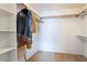 Walk-in closet with shelves and hanging rods for ample storage at 4719 Sparta Way, North Las Vegas, NV 89032