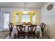 Dining room with large bay windows for natural light and seating for six at 4719 Sparta Way, North Las Vegas, NV 89032