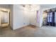 Welcoming entryway featuring neutral carpet and tile, with a charming pendant light fixture at 4719 Sparta Way, North Las Vegas, NV 89032