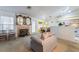 Open living room, dining, and kitchen space with natural light and fireplace at 4719 Sparta Way, North Las Vegas, NV 89032