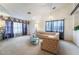 Bright and airy living room with a large window, plush seating, and elegant decor at 4719 Sparta Way, North Las Vegas, NV 89032