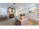 Open living room, dining, and kitchen space with natural light and fireplace at 4719 Sparta Way, North Las Vegas, NV 89032