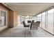Enclosed patio area with dining set, offering a serene outdoor space at 4719 Sparta Way, North Las Vegas, NV 89032