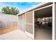 View of a covered and screened patio with outdoor furniture, offering a comfortable space for relaxation at 4719 Sparta Way, North Las Vegas, NV 89032