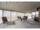 Screened patio with seating area, perfect for outdoor entertaining at 4719 Sparta Way, North Las Vegas, NV 89032