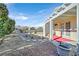 Backyard featuring covered patio, desert landscaping, and bird bath at 5429 Sweet Shade St, Las Vegas, NV 89130
