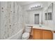 Bathroom with white shower curtain, tub, sink and cabinet at 5429 Sweet Shade St, Las Vegas, NV 89130