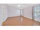 Bright bedroom offers wood floors, vaulted ceiling, large windows, and neutral walls at 5429 Sweet Shade St, Las Vegas, NV 89130