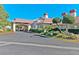 Beautiful clubhouse featuring a portico and mature landscaping creating a welcoming entrance for residents at 5429 Sweet Shade St, Las Vegas, NV 89130