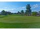 Expansive golf course view with mature trees, and blue skies in a serene park-like setting at 5429 Sweet Shade St, Las Vegas, NV 89130