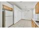 Functional kitchen boasts tile floors, white appliances, and light wood cabinets with generous storage at 5429 Sweet Shade St, Las Vegas, NV 89130