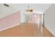 Open living area with wood floors, ceiling fan, stylish lighting and easy access to other rooms at 5429 Sweet Shade St, Las Vegas, NV 89130