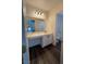 Bathroom featuring modern cabinets, large mirror, and tile flooring at 5591 La Perla Ct, Las Vegas, NV 89122