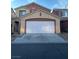 Charming two-story home with a two car garage and neutral paint colors at 5591 La Perla Ct, Las Vegas, NV 89122