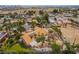 An aerial view showcases a home with an expansive backyard, complete with desert landscaping and a covered gazebo at 5829 W Patrick Ln, Las Vegas, NV 89118