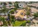 An aerial view captures a home boasting a large yard with desert landscaping and charming outdoor structures at 5829 W Patrick Ln, Las Vegas, NV 89118