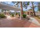 An expansive backyard with a gazebo and patio offers serene outdoor living spaces, accented by mature landscaping at 5829 W Patrick Ln, Las Vegas, NV 89118