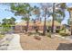 Spacious backyard featuring a patio and desert landscaping, creating a serene outdoor space at 5829 W Patrick Ln, Las Vegas, NV 89118