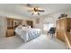 This bedroom features built-in storage and a window with arched shutters at 5829 W Patrick Ln, Las Vegas, NV 89118