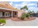 Charming home exterior with a covered patio and well-maintained landscaping for outdoor enjoyment at 5829 W Patrick Ln, Las Vegas, NV 89118
