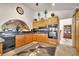 Well-equipped kitchen featuring a breakfast bar, black appliances, and wooden cabinets at 5829 W Patrick Ln, Las Vegas, NV 89118