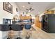 Open kitchen with breakfast bar, modern appliances, and ample cabinet space at 5829 W Patrick Ln, Las Vegas, NV 89118