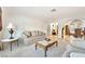Bright living room features plush seating, tile flooring, and an arched doorway at 5829 W Patrick Ln, Las Vegas, NV 89118