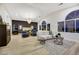 Open-concept living area featuring a bedroom view, stylish furniture, and ample natural light at 62 Incline Village Ct, Henderson, NV 89074