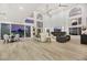 Open-concept living space with high ceilings, statement fireplace, and comfortable seating at 62 Incline Village Ct, Henderson, NV 89074